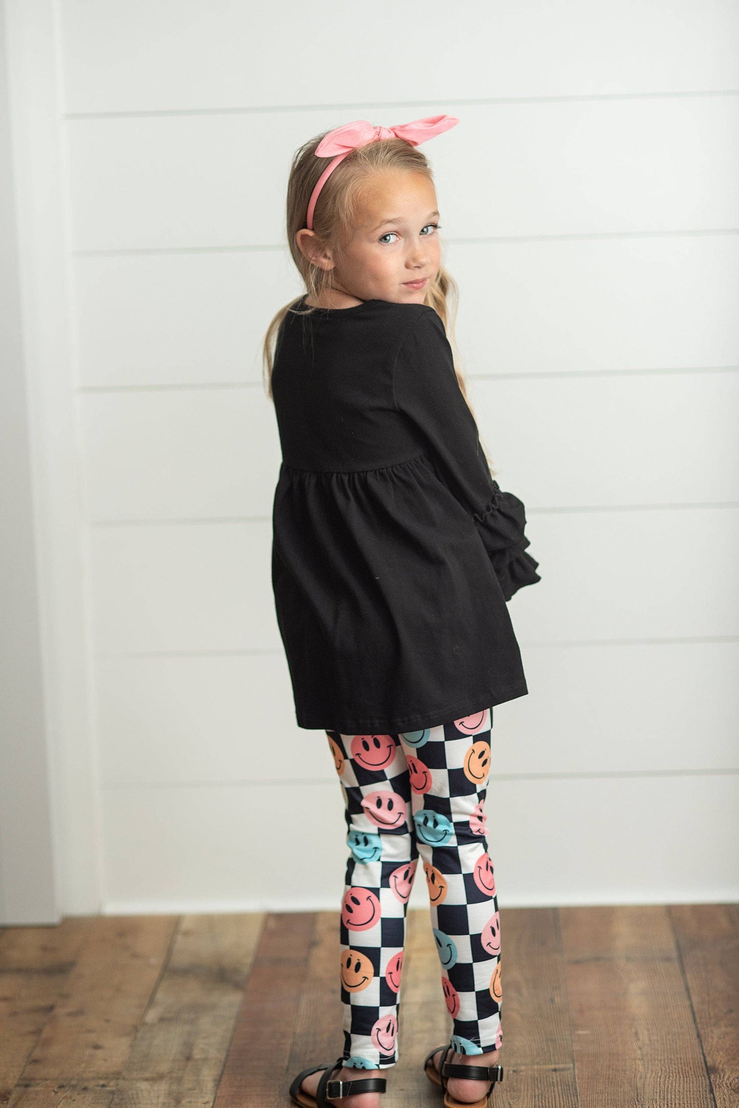 Black Ruffle Top with Black & White Check Smiley Face Leggings Set