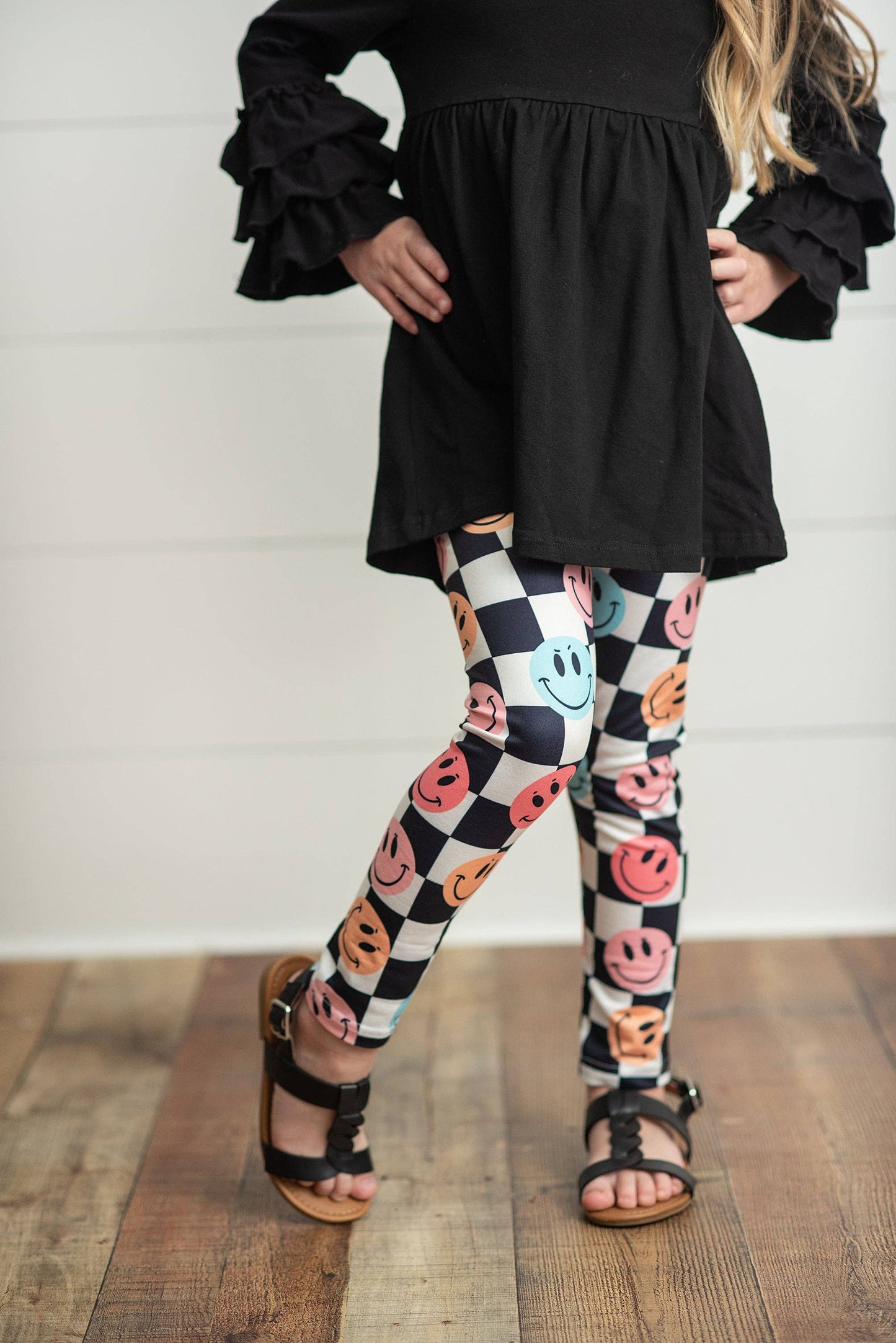 Black Ruffle Top with Black & White Check Smiley Face Leggings Set